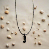 CHARMED steel necklace with sea horse pendant