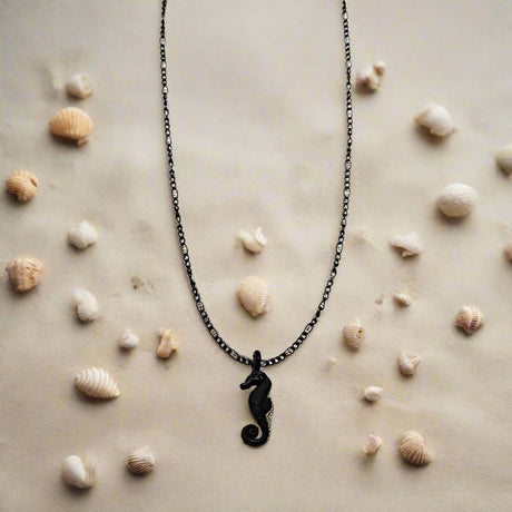 CHARMED steel necklace with sea horse pendant